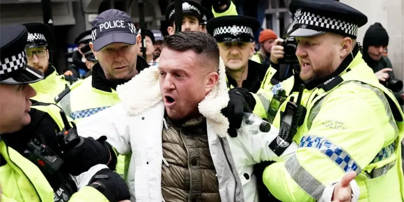 Tommy Robinson charged after attending antisemitism march in London